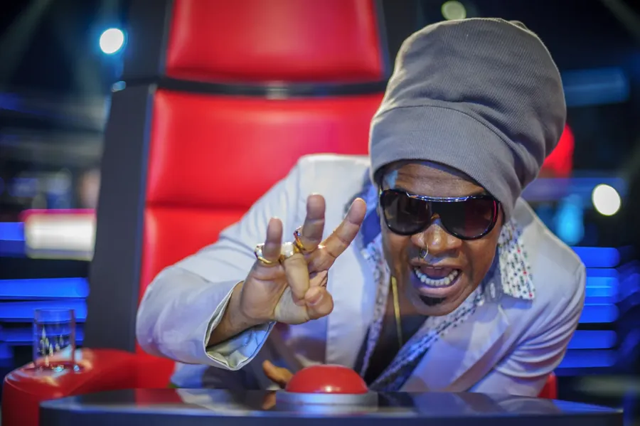 Carlinhos Brown na cadeira de técnico do The Voice Brasil, em 2012. Foi o time dele que Karina escolheu em 2020. Foto: Alex Carvalho, via Wikimedia Commons, CC BY-SA 2.0.